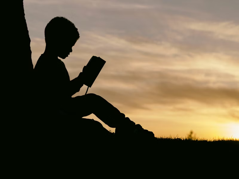 Child reading silhouette